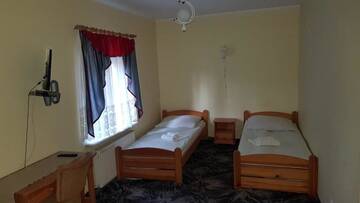 Фото номера Небольшой двухместный номер с 2 отдельными кроватями Мотели Motel Domek Myśliwski г. Bobolice 6